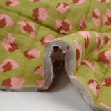 Double gaze matelassée double face Bangkok fond blanc et vert au mètre