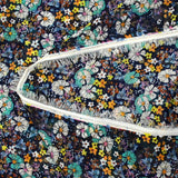 Mousseline crinkle imprimée lurex prairie fleurie turquoise fond marine