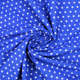 Coton imprimé étoiles fond bleu roi