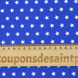 Coton imprimé étoiles fond bleu roi