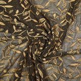 Maille dentelle ajourée motif végétal doré fond noir