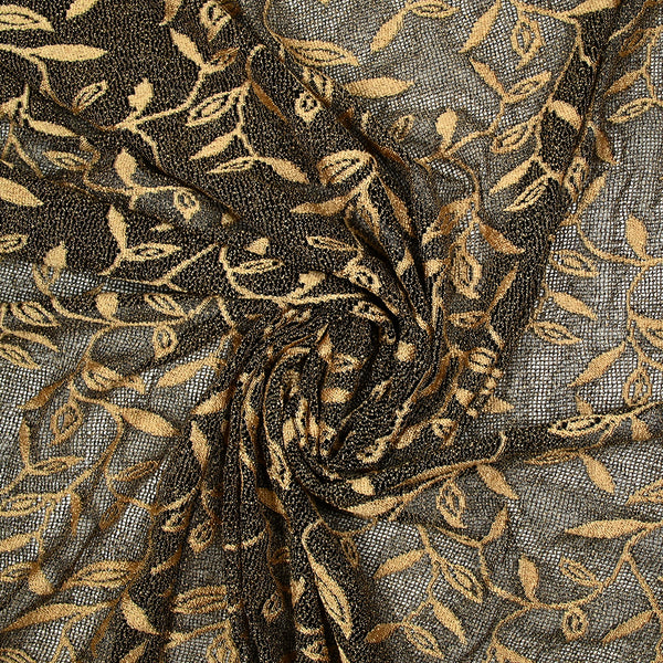 Maille dentelle ajourée motif végétal doré fond noir
