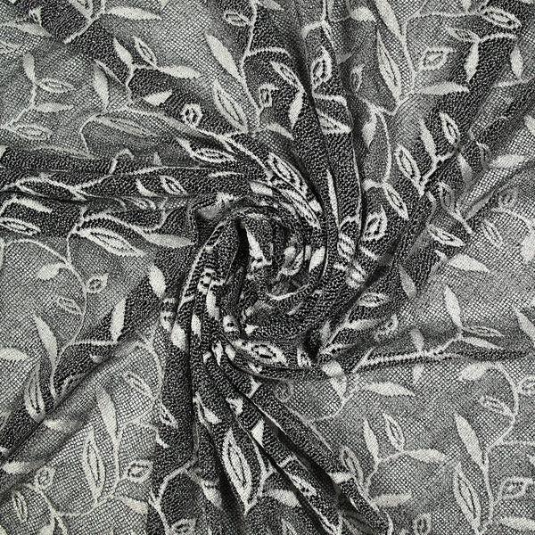Maille dentelle ajourée motif végétal blanc fond noir
