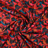 Crêpe satiné de polyester Amaryllis rouge et bleu canard fond noir