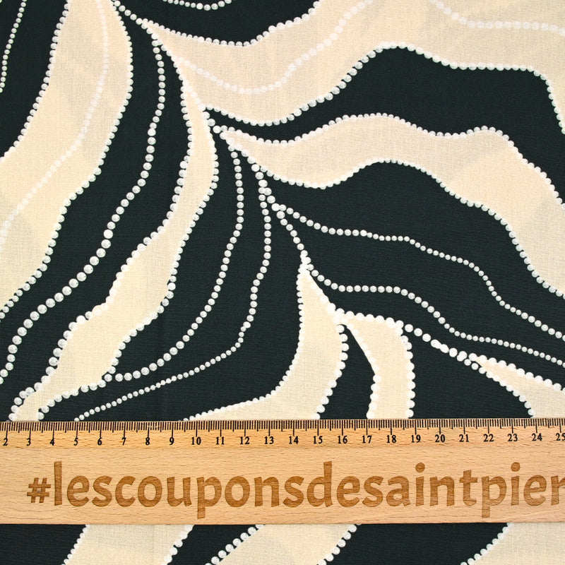 Coton imprimé feuille écru en pointillé fond vert foncé
