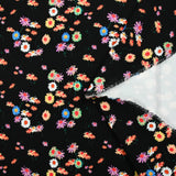 Jersey de viscose imprimé fleur psychédélique fond noir