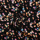 Jersey de viscose imprimé fleur psychédélique fond noir