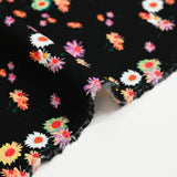 Jersey de viscose imprimé fleur psychédélique fond noir