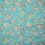 Viscosa estampada primavera blanco roto con fondo azul azurin