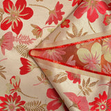 Brocart lamé éclat de fleurs doré et rouge coquelicot