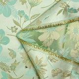 Brocart lamé éclat de fleurs doré et vert d'eau