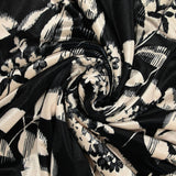 Short velvet jersey with black graphic leaf print and ivory background