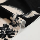 Short velvet jersey with black graphic leaf print and ivory background