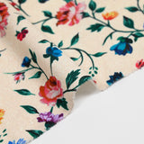 Viscose knit printed with small country flowers on beige background