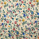 Viscose knit printed with small country flowers on beige background