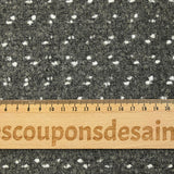 Polyester terry wool and white confetti, gray background