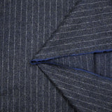 Tissu tailleur en laine mélangée rayure blanche fond gris anthracite moucheté bleu roi