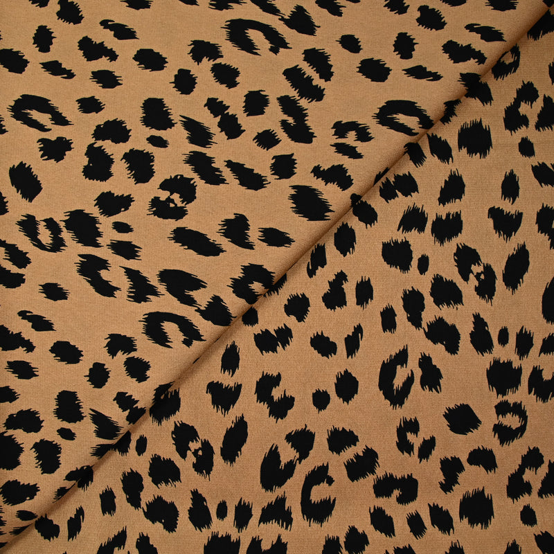 Crêpe satiné de polyester sauvage noire fond mordoré