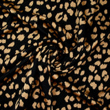 Crêpe satiné de polyester sauvage mordoré fond noir