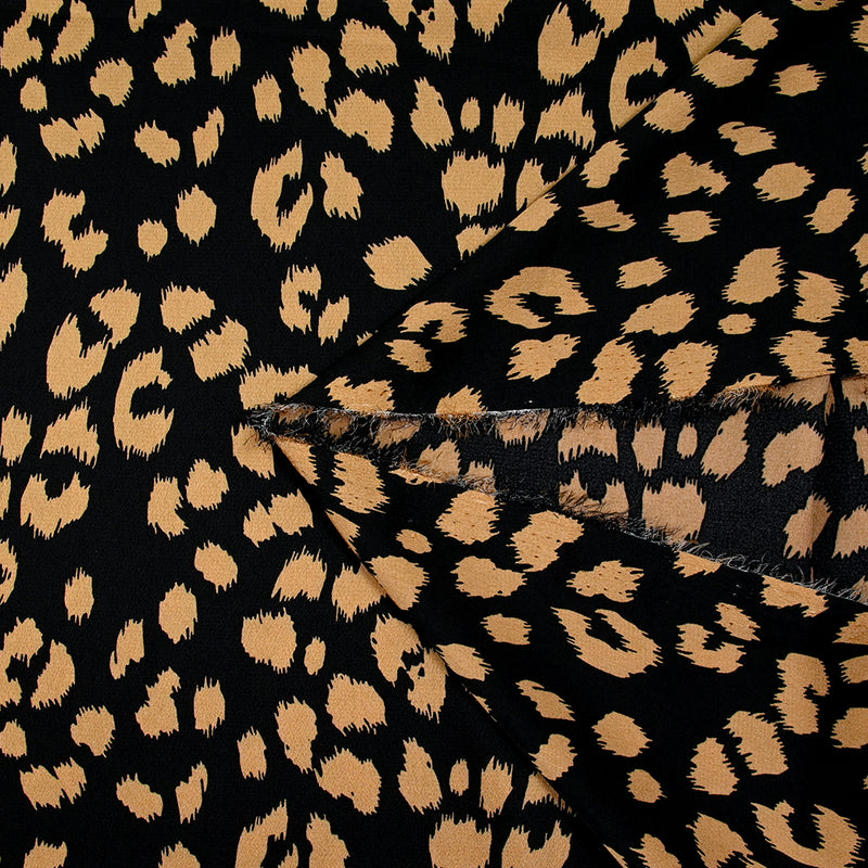 Crêpe satiné de polyester sauvage mordoré fond noir