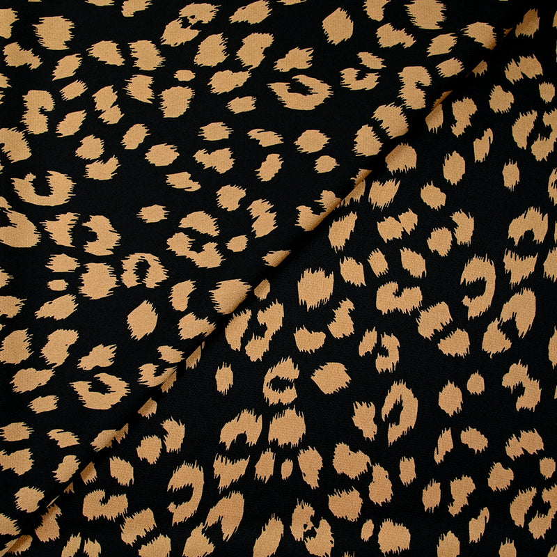 Crêpe satiné de polyester sauvage mordoré fond noir