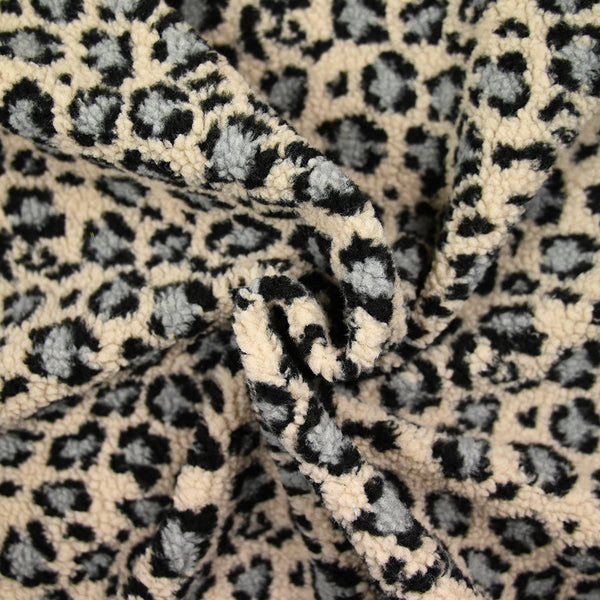 Fausse fourrure léopard gris fond beige