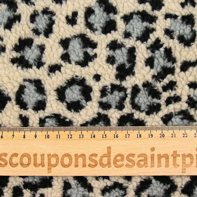 Fausse fourrure léopard gris fond beige