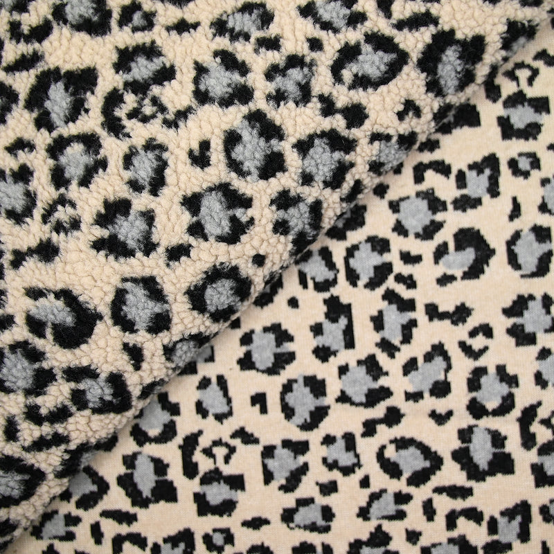 Fausse fourrure léopard gris fond beige