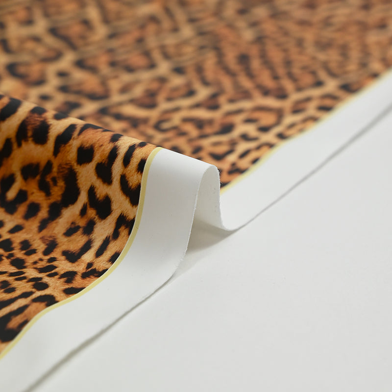 Tissu imperméable déperlant imprimé fourrure léopard fond jaune