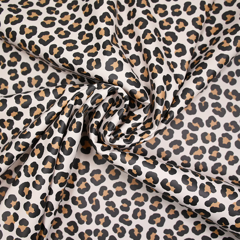 Tissu imperméable déperlant imprimé tacheté marron fond beige