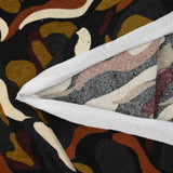 Maille tricot imprimée vague marron et écru fond noir