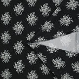 Crêpe printed gray flower medallion black background