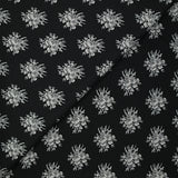 Crêpe printed gray flower medallion black background