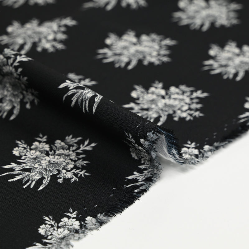 Crêpe printed gray flower medallion black background