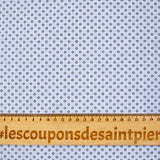 Coton tissé teint imprimé soleil noir fond bleu