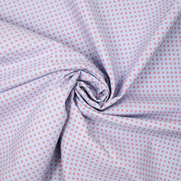Coton tissé teint imprimé soleil rouge fond bleu