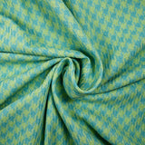 Tweed de polyester pied de poule anis fond turquoise