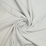 Viscosa estampada con lunares blancos.