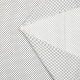 Viscosa estampada con lunares blancos.