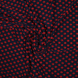Maille polyviscose floquée pois rouge fond bleu marine