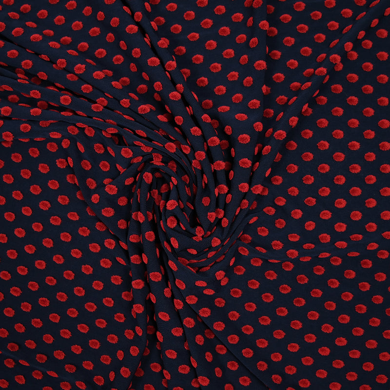 Maille polyviscose floquée pois rouge fond bleu marine
