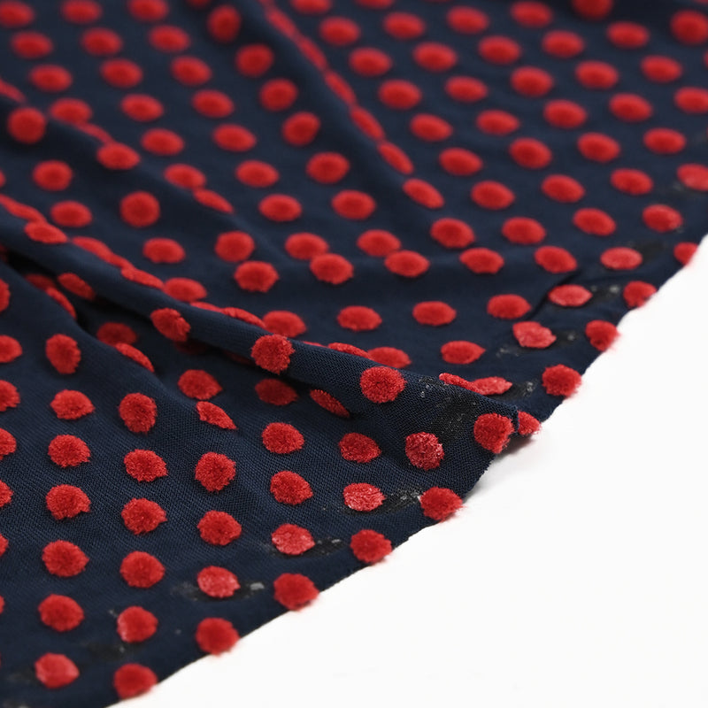 Maille polyviscose floquée pois rouge fond bleu marine