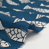 Indian cotton fish print, petrol blue background
