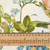 Viscose imprimée fleurs printanières bleues, jaunes et roses fond écru