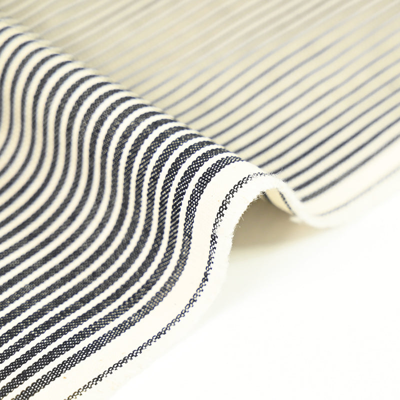 Polycoton tissé teint rayé bleu marine fond écru