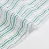 Voile de algodón teñido con tejido de rayas verdes y fondo blanco.