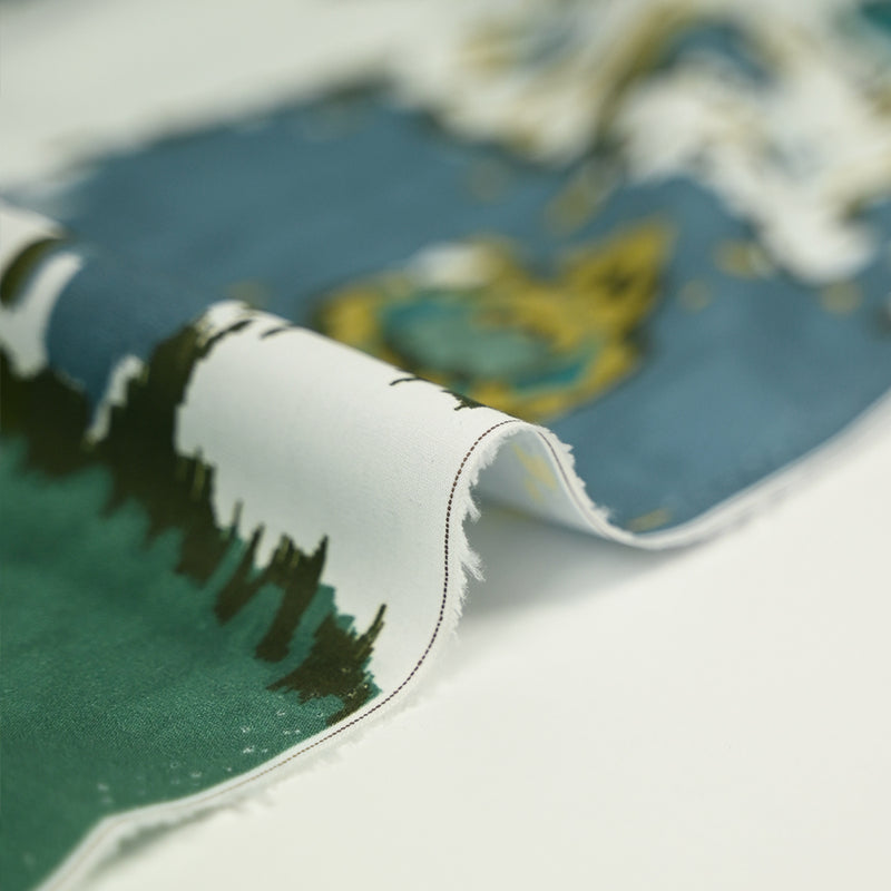 Coton imprimé ikat vert et bleu fond blanc