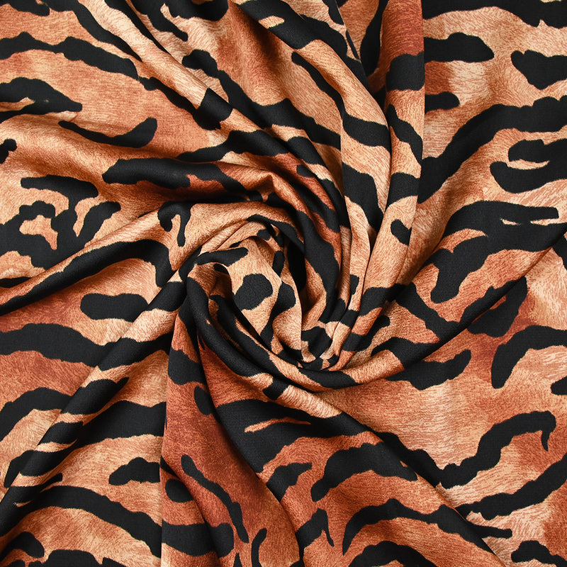 Crêpe satiné de polyester tigre noir fond marron