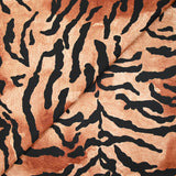 Crêpe satiné de polyester tigre noir fond marron