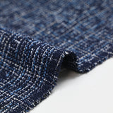 Tweed de polyester blanc et bleu ciel fond bleu marine